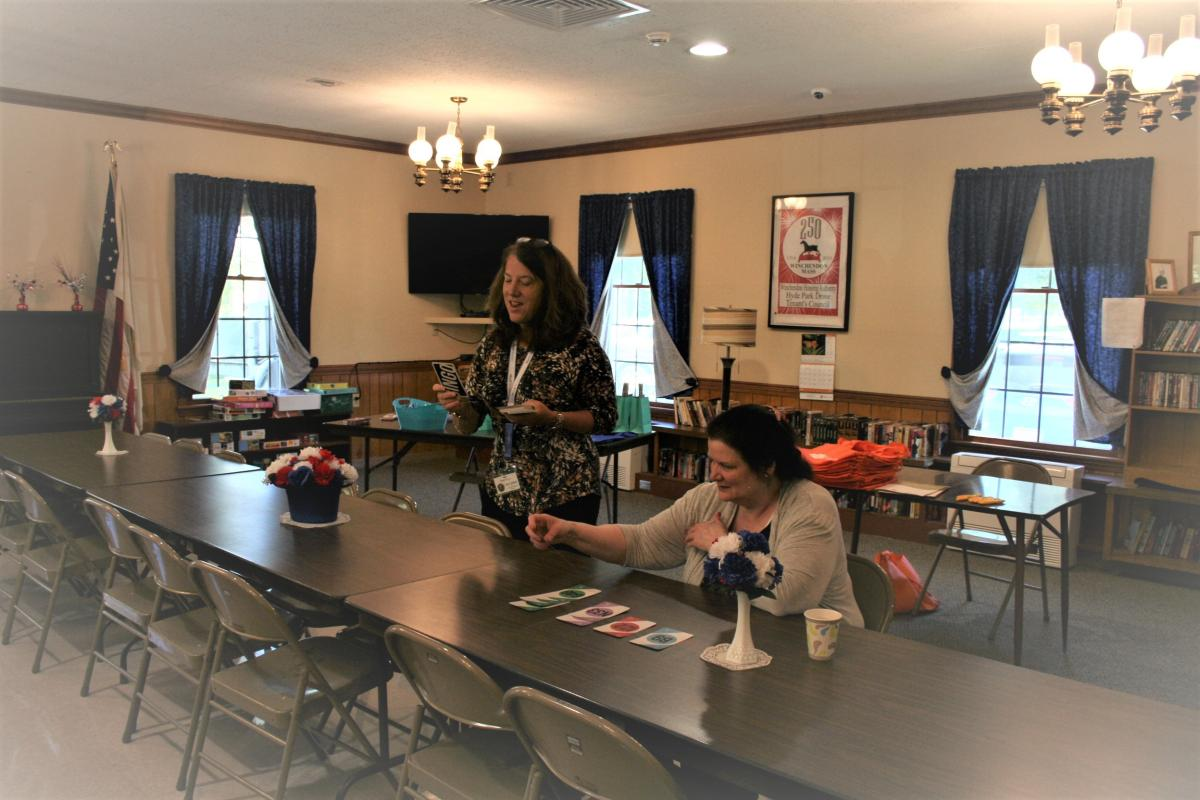 Cheryl Burgess from MedMinder Pharmacy calling the Bingo numbers